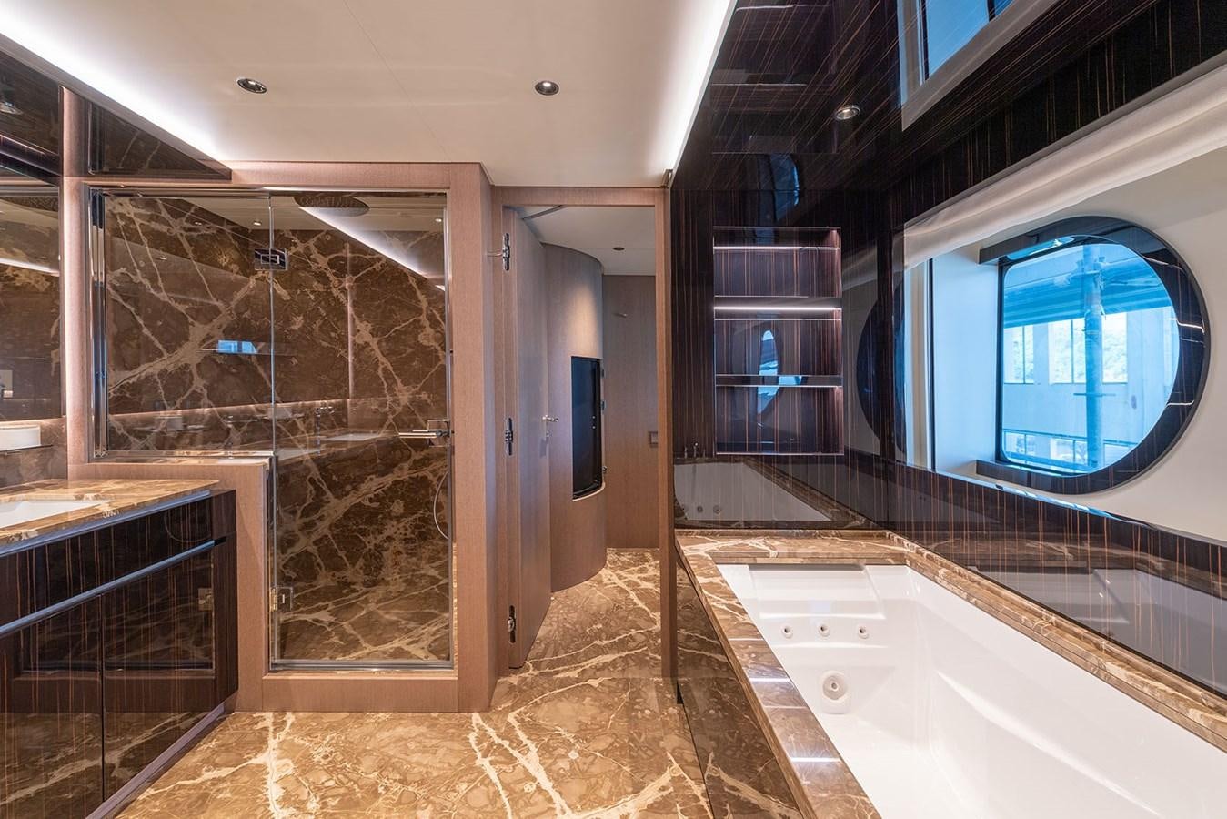 a large bathroom with a large glass shower aboard BARON TRENCK Yacht for Sale