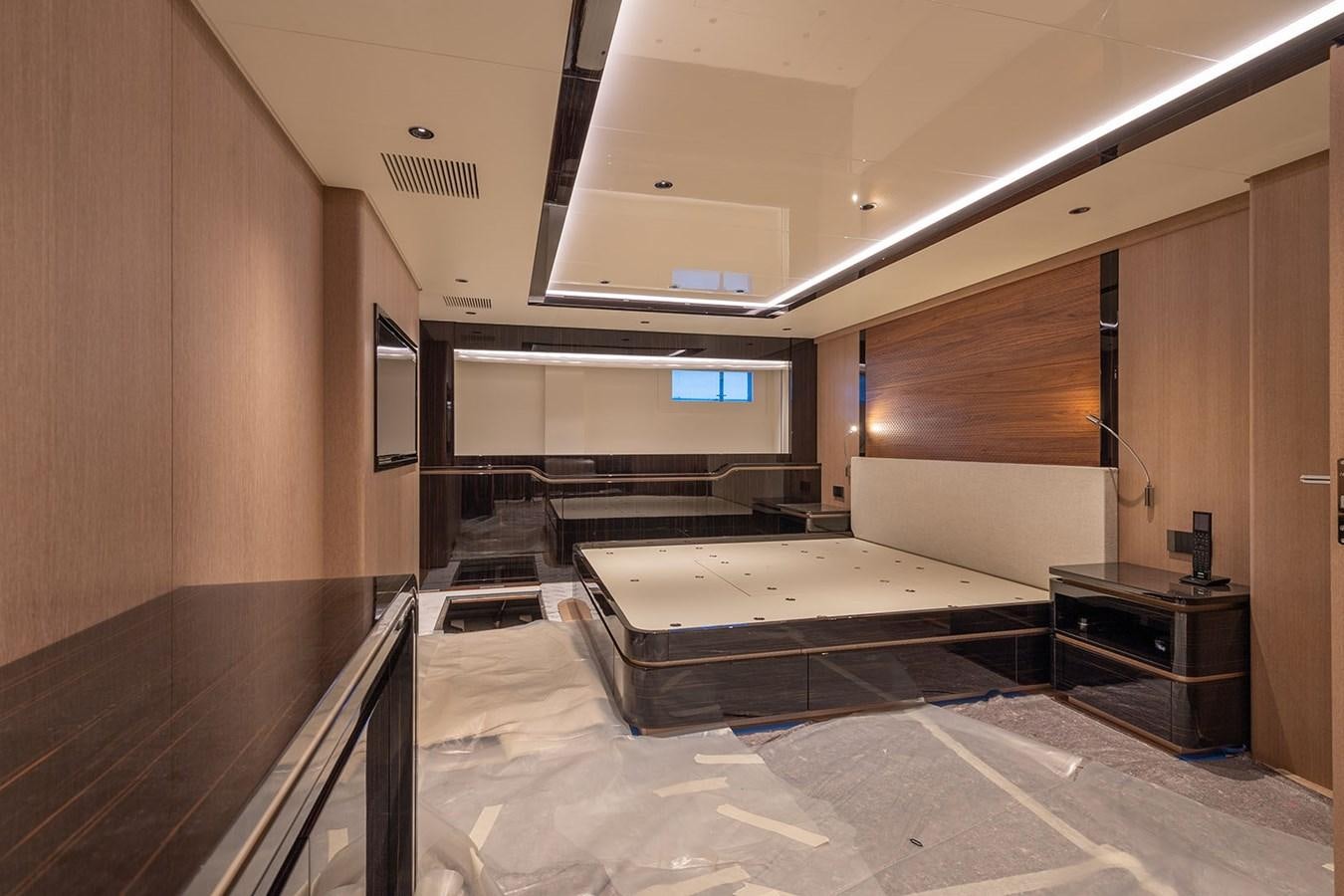 a room with a bed and a desk aboard BARON TRENCK Yacht for Sale