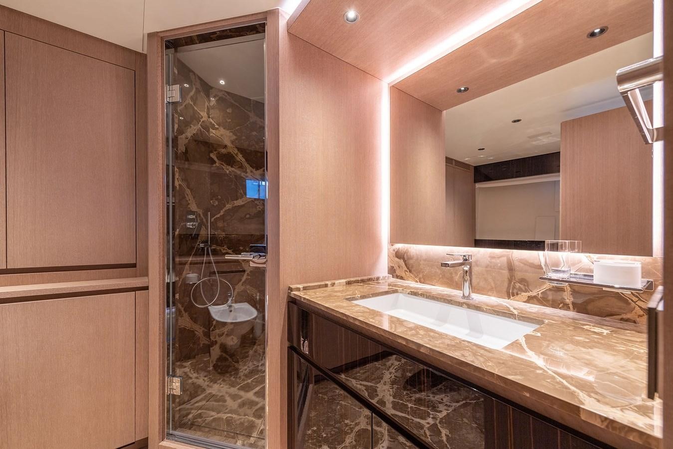a bathroom with a glass shower aboard BARON TRENCK Yacht for Sale