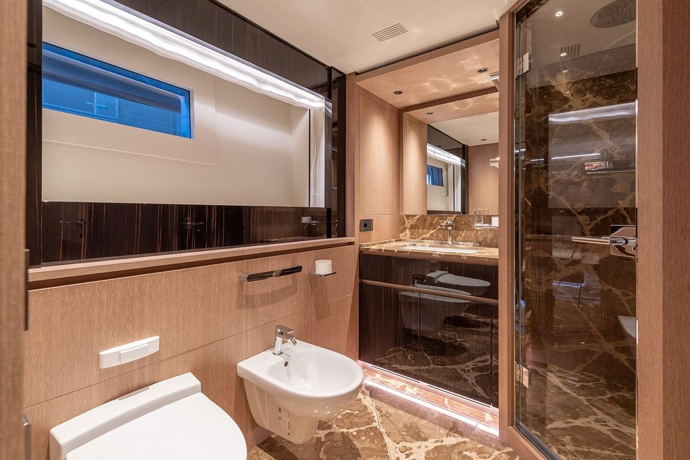 a bathroom with a glass shower aboard BARON TRENCK Yacht for Sale