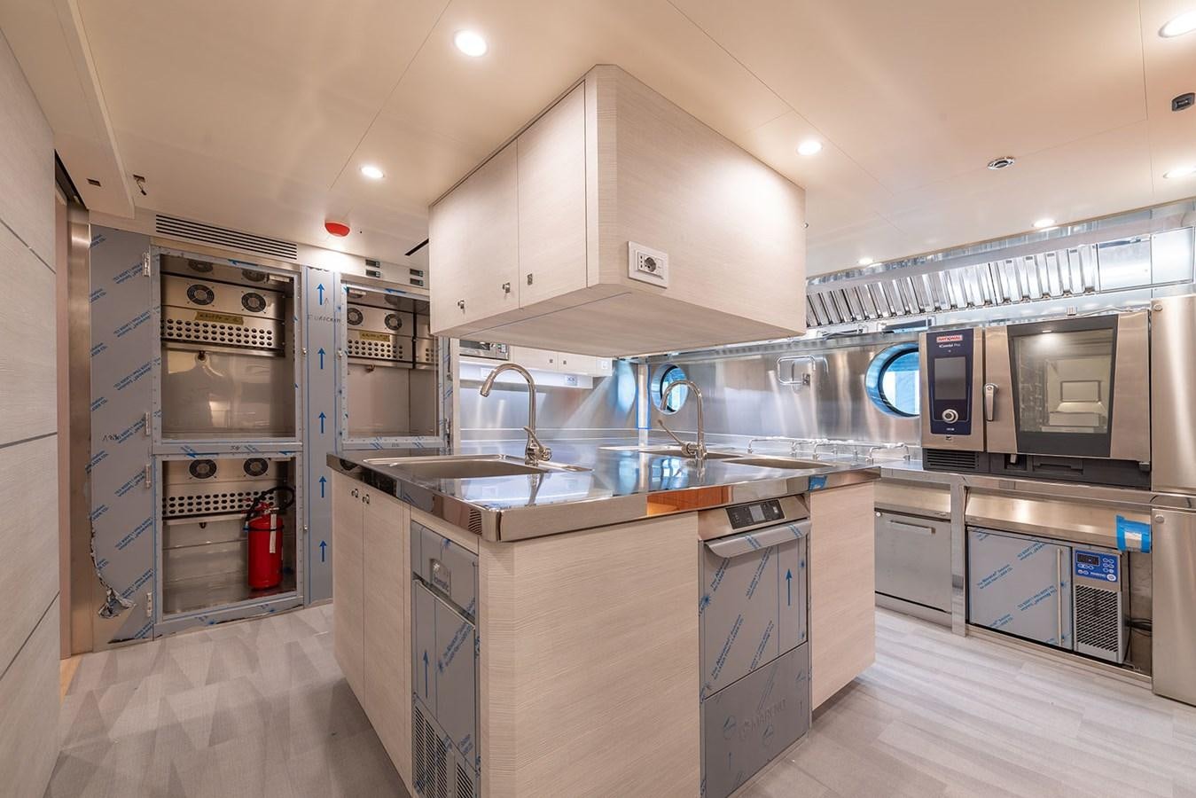 a kitchen with stainless steel appliances aboard BARON TRENCK Yacht for Sale