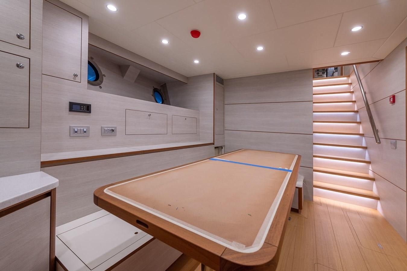 a room with a large jacuzzi tub and a wooden staircase aboard BARON TRENCK Yacht for Sale