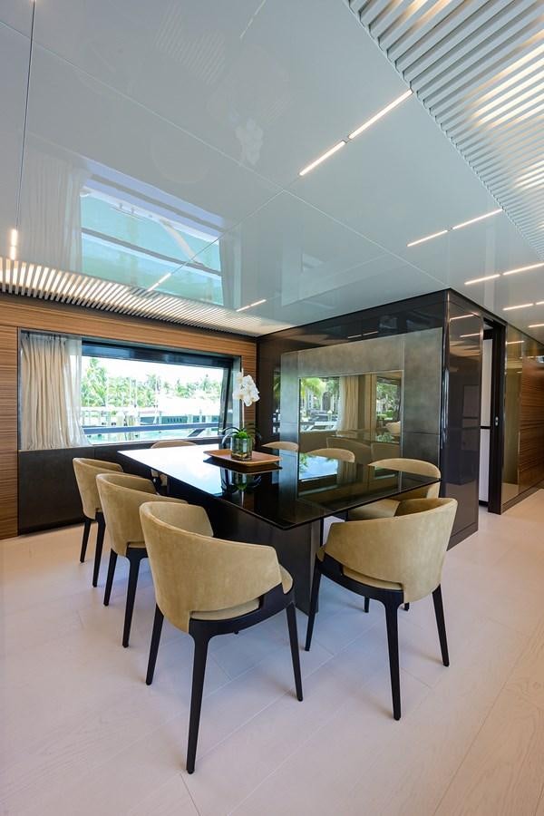 a table and chairs in a room aboard DATE NIGHT Yacht for Sale