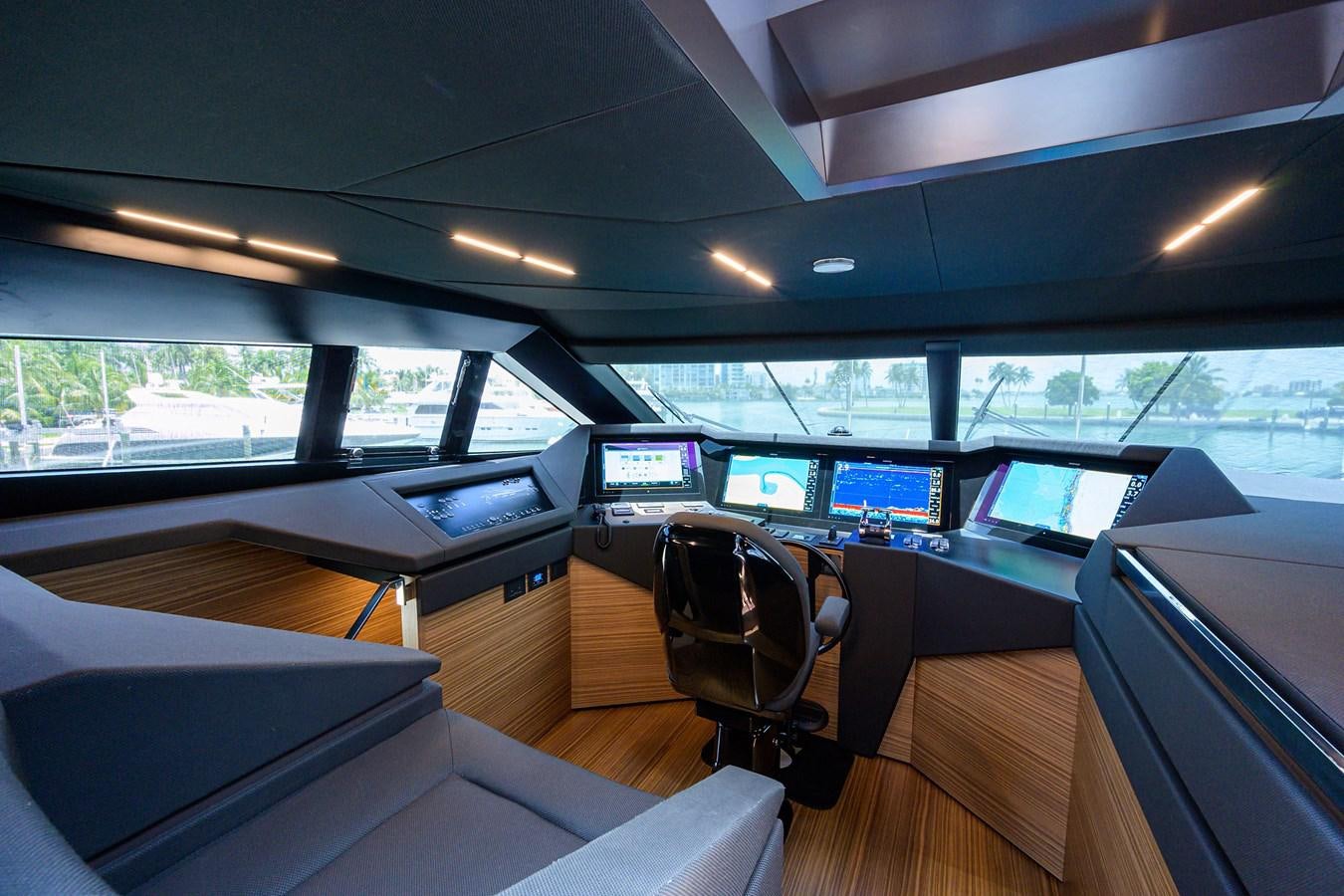 a room with computers and chairs aboard DATE NIGHT Yacht for Sale