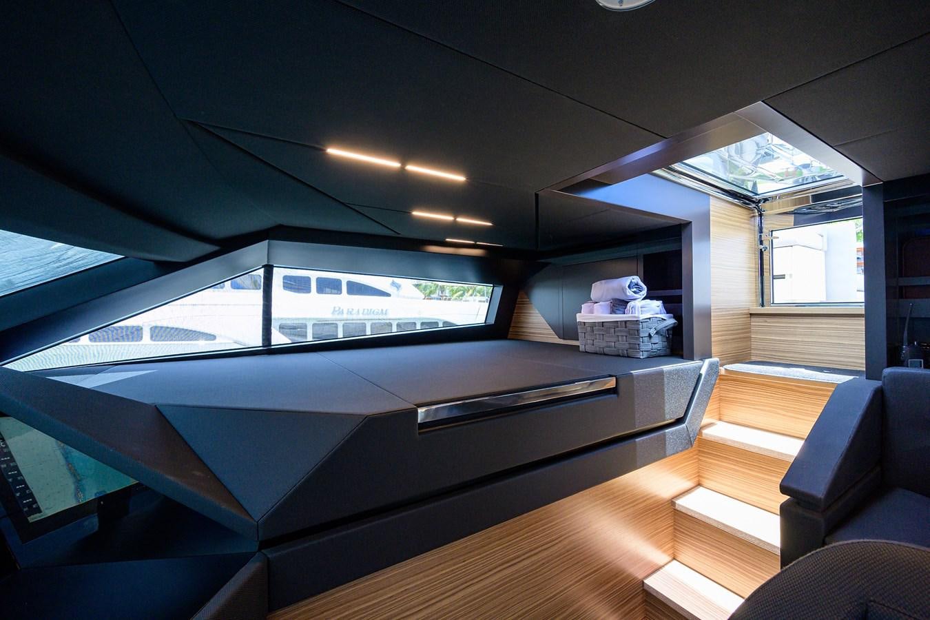 a room with a large window and a large screen aboard DATE NIGHT Yacht for Sale