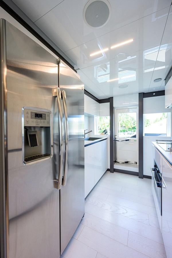 a large kitchen with stainless steel appliances aboard DATE NIGHT Yacht for Sale