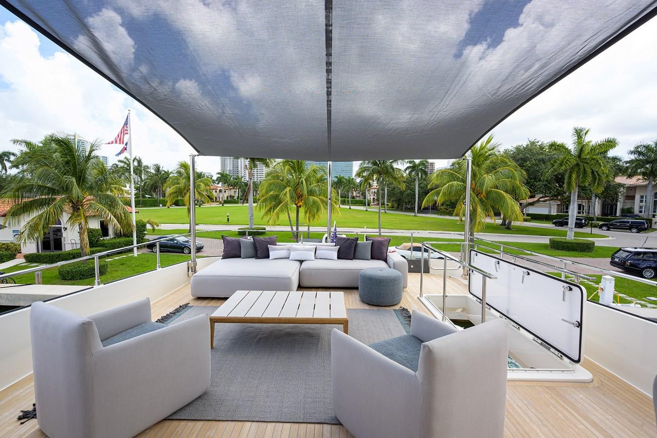 a patio with a large umbrella aboard DATE NIGHT Yacht for Sale
