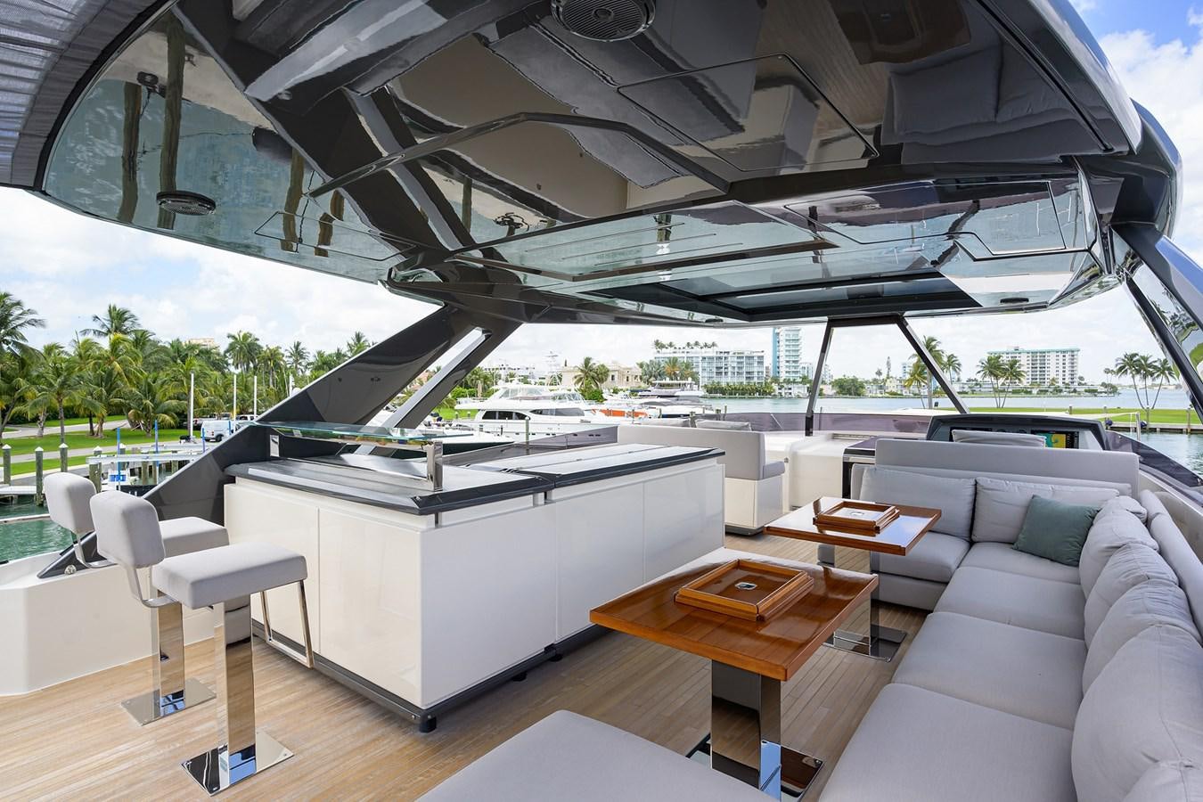 a room with a couch and a table and a large fan aboard DATE NIGHT Yacht for Sale
