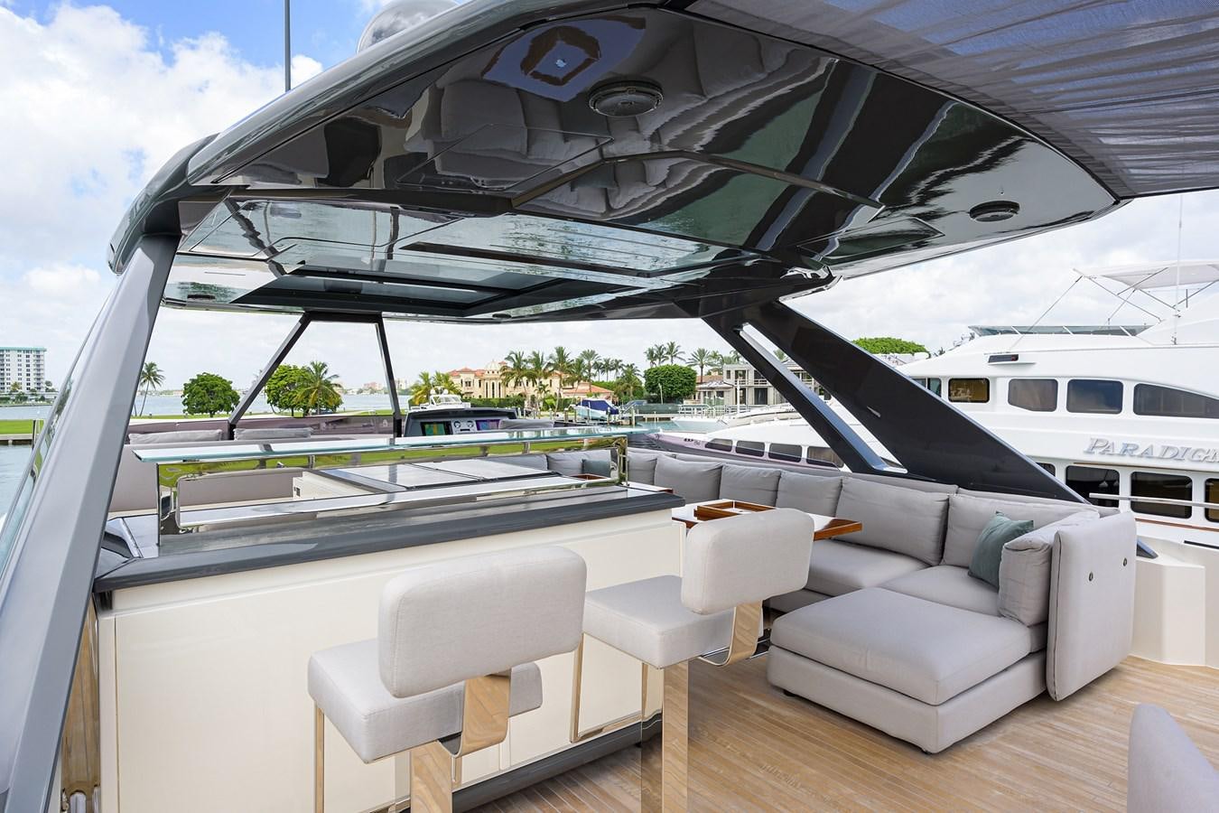 a large lounge area with a large deck and a large swimming pool aboard DATE NIGHT Yacht for Sale
