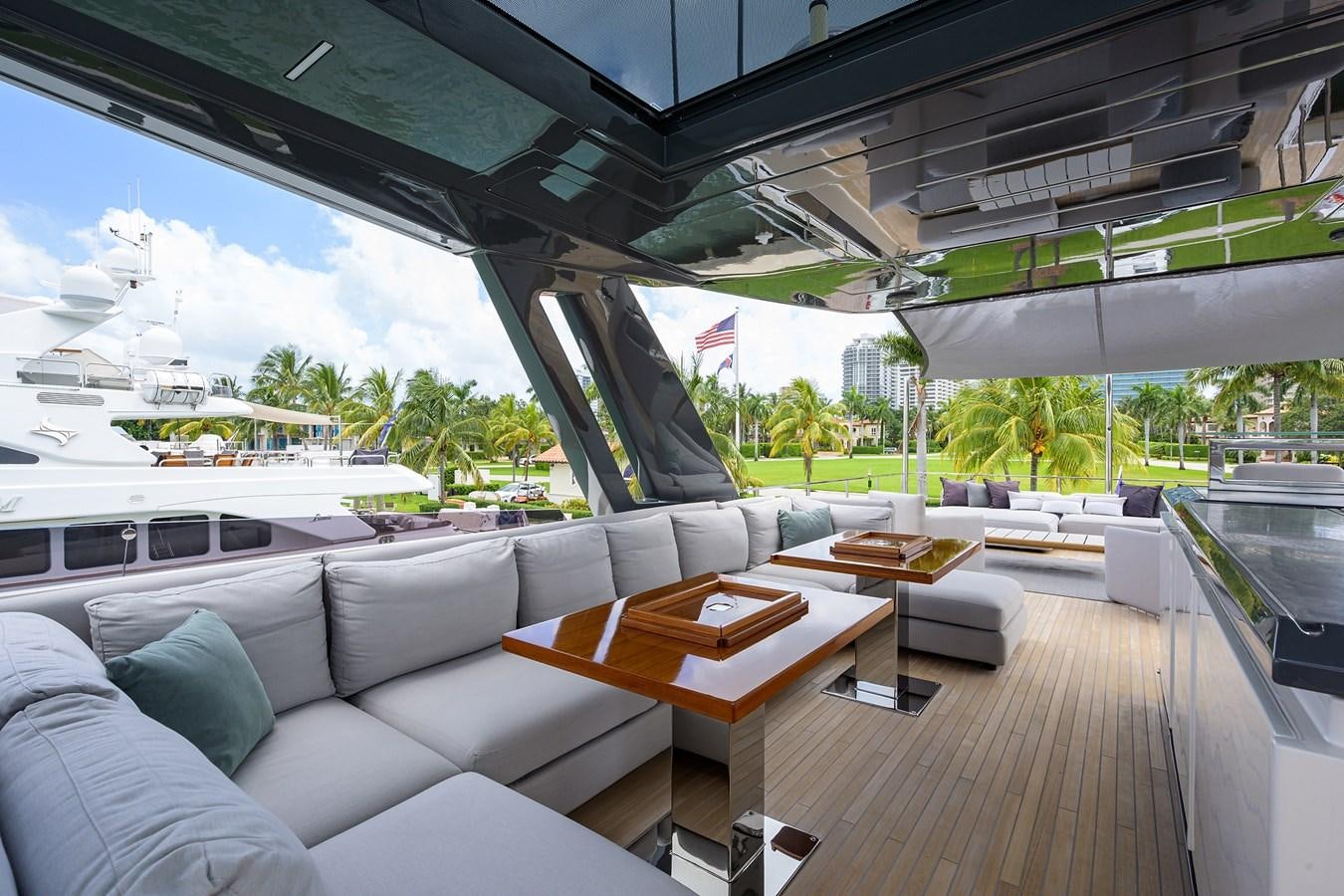 a room with a couch and a table and a large window aboard DATE NIGHT Yacht for Sale