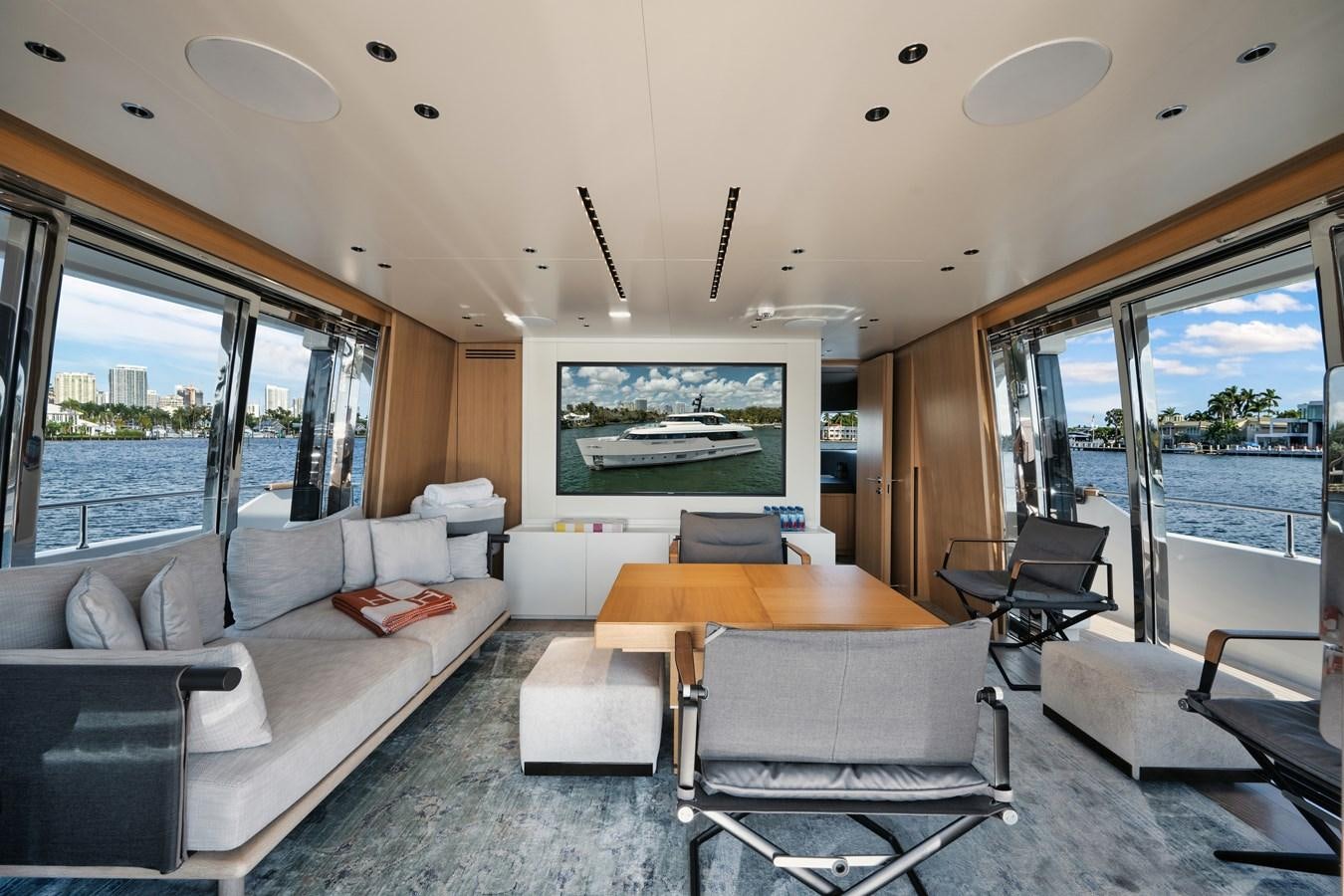 a living room with a large window aboard DON'T TELL MOM  Yacht for Sale
