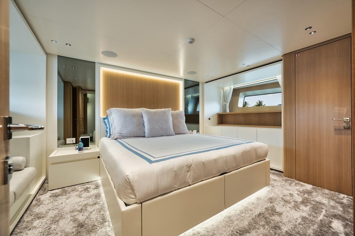 a bedroom with a bed and a mirror aboard DON'T TELL MOM  Yacht for Sale
