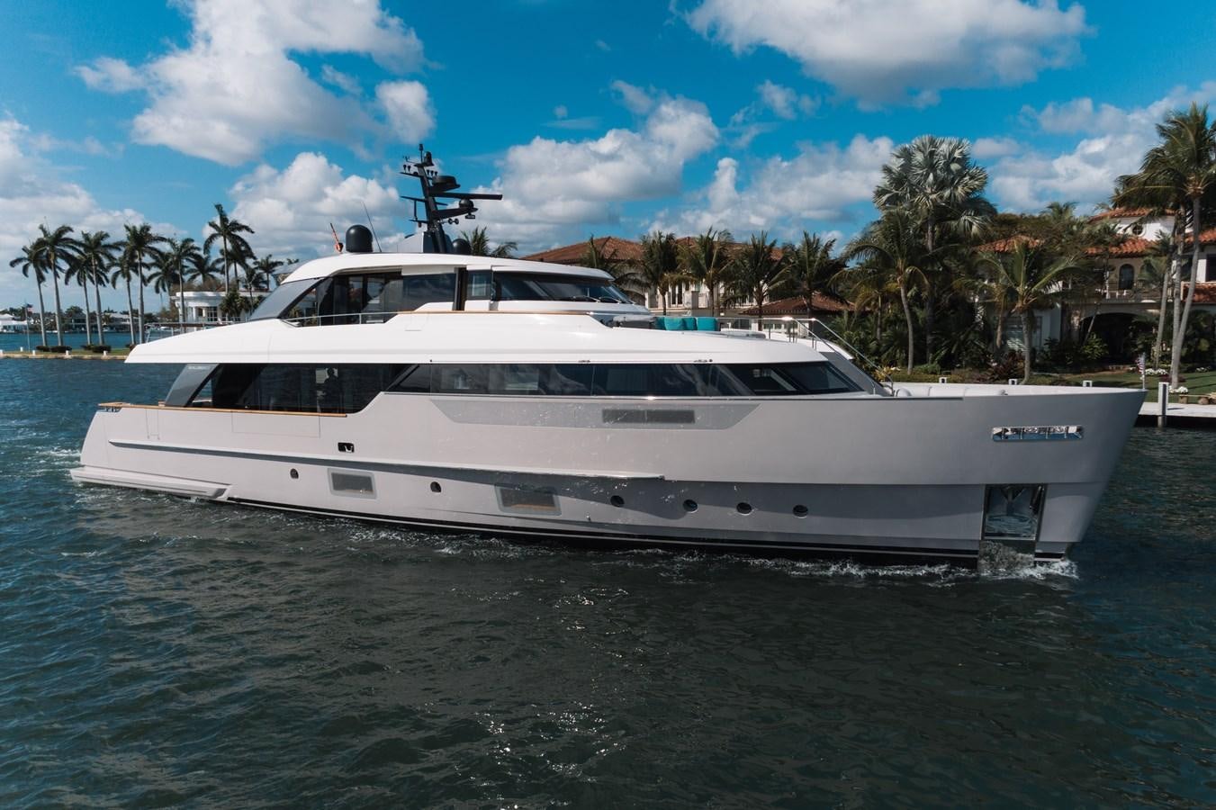 a white yacht in the water aboard DON'T TELL MOM  Yacht for Sale