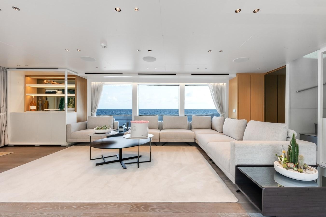 a living room with a large window aboard DON'T TELL MOM  Yacht for Sale