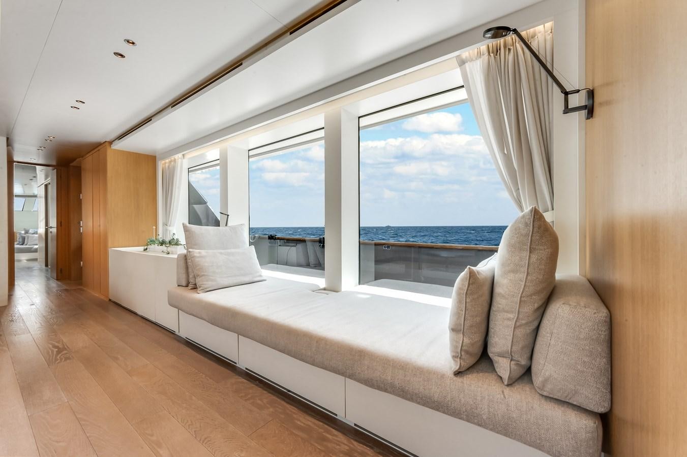a room with a large window and a view of the ocean aboard DON'T TELL MOM  Yacht for Sale