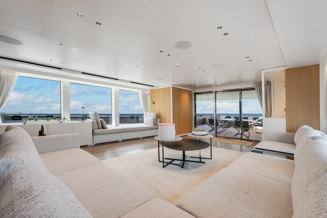 a living room with a large window aboard DON'T TELL MOM  Yacht for Sale