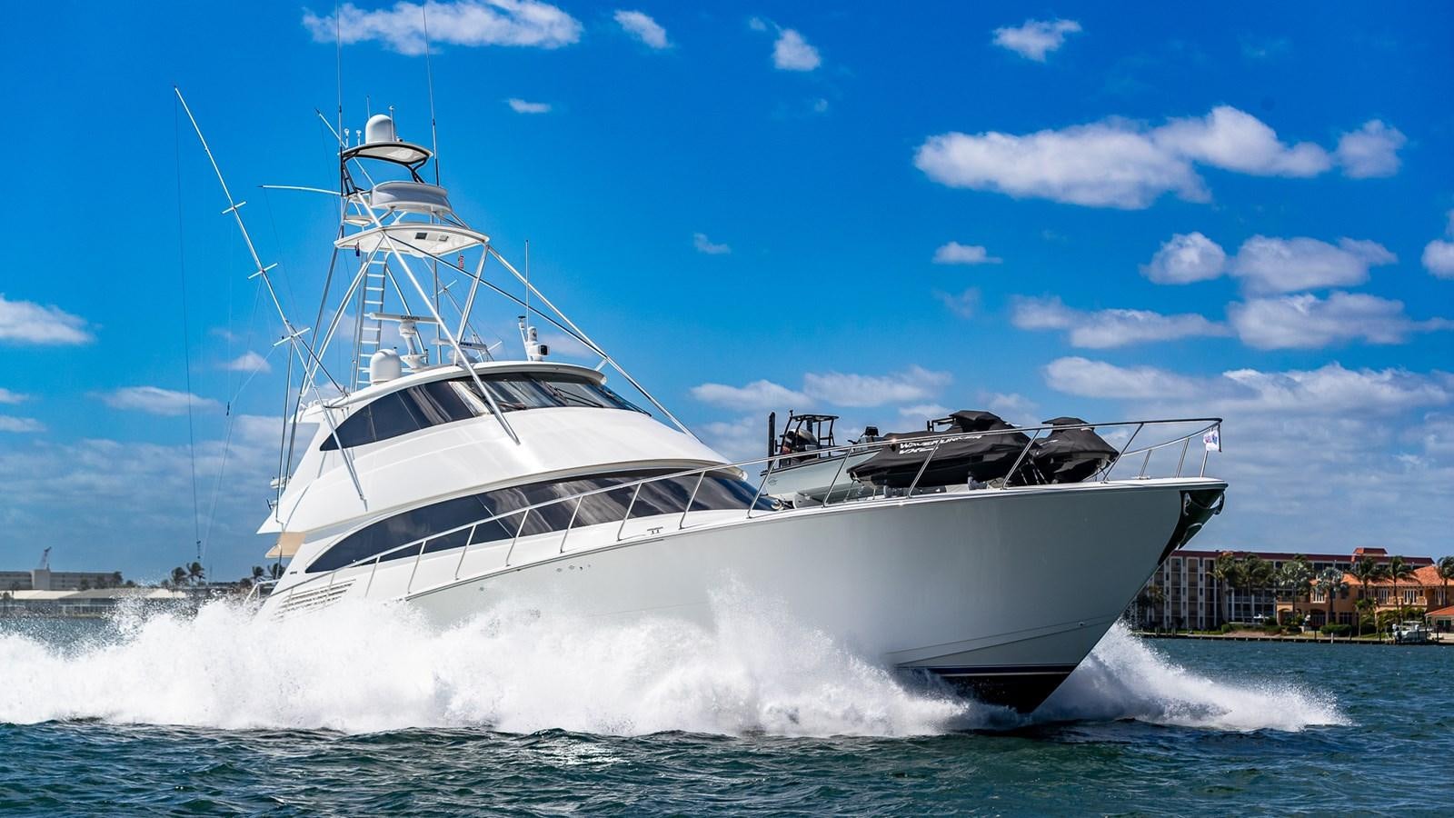 a white yacht on the water aboard AUSSIE RULES Yacht for Sale