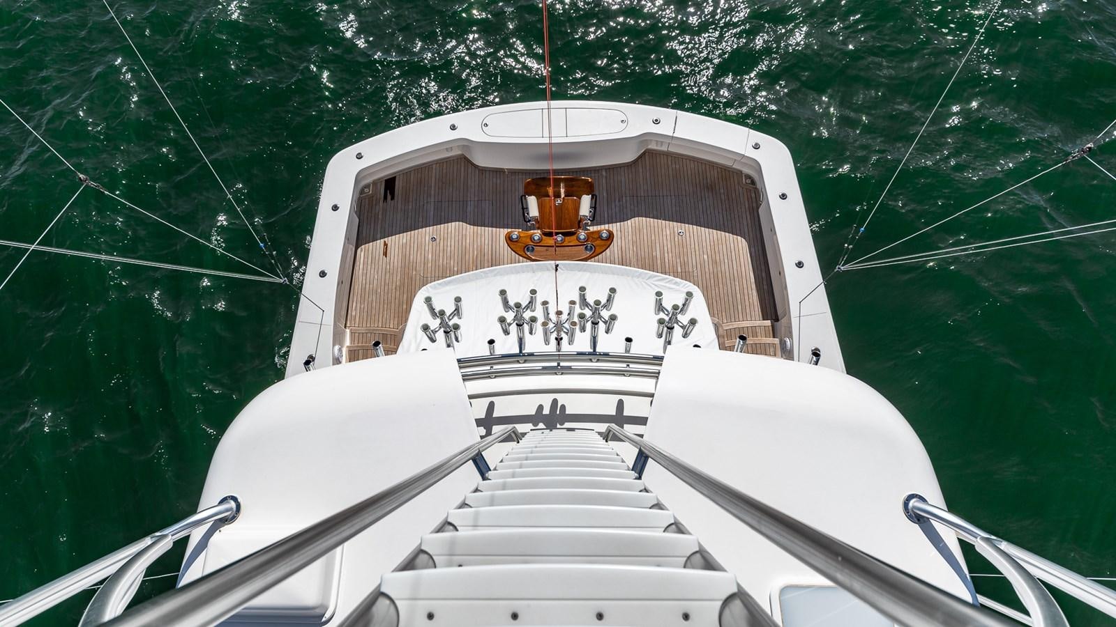 a boat with a small tower aboard AUSSIE RULES Yacht for Sale