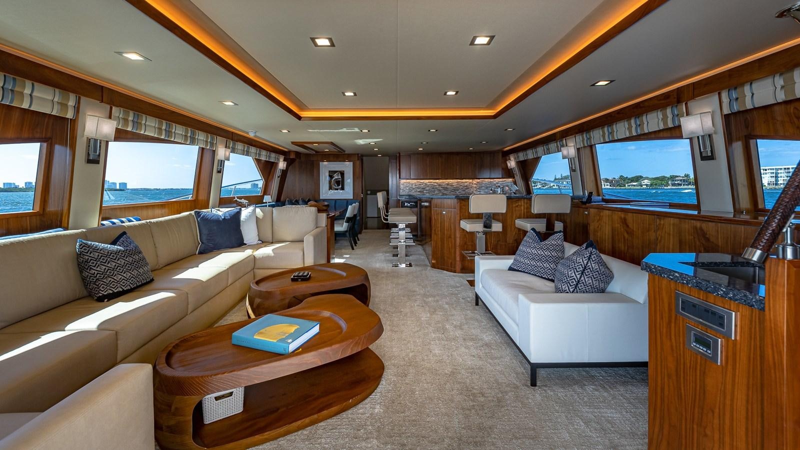 a living room with a couch and a table aboard AUSSIE RULES Yacht for Sale