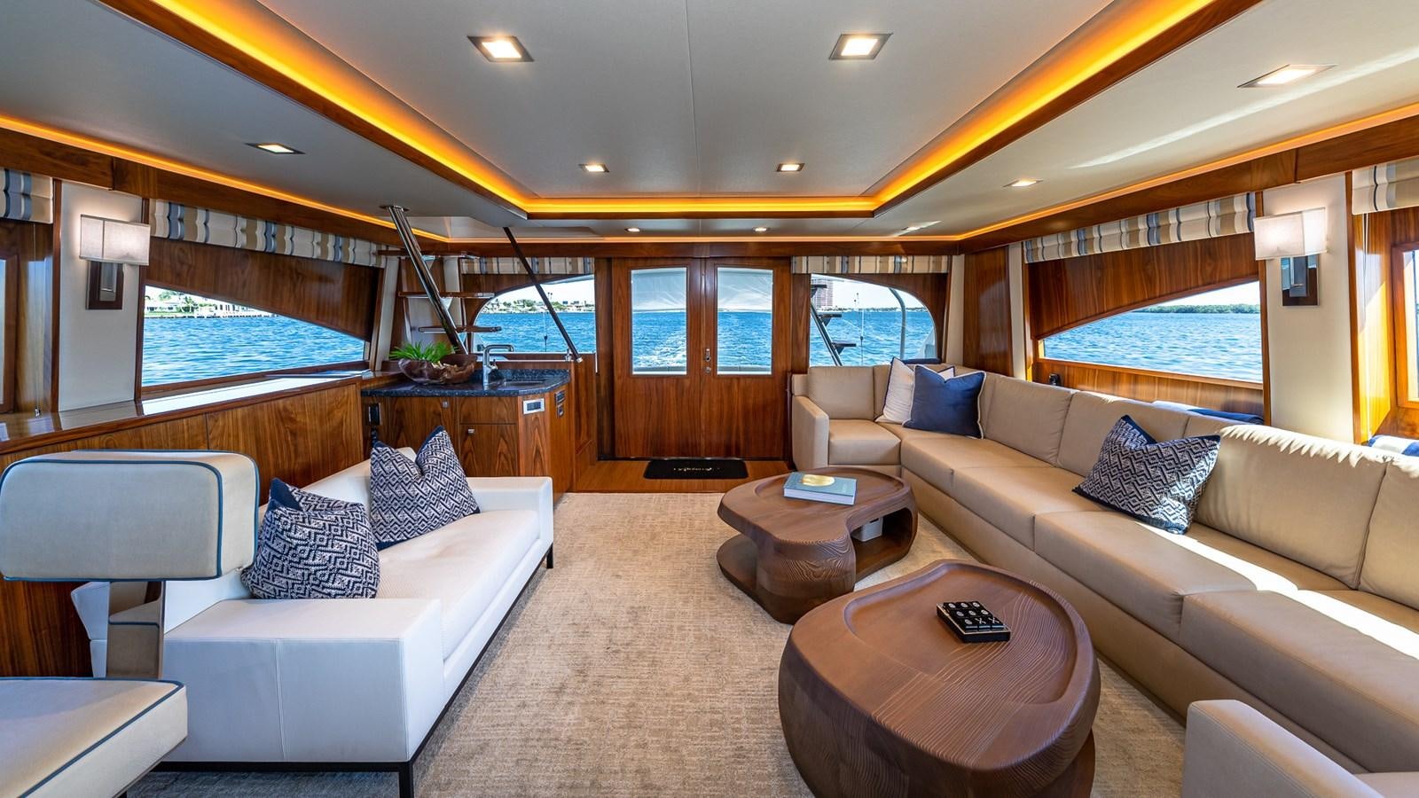 a living room with a large window aboard AUSSIE RULES Yacht for Sale