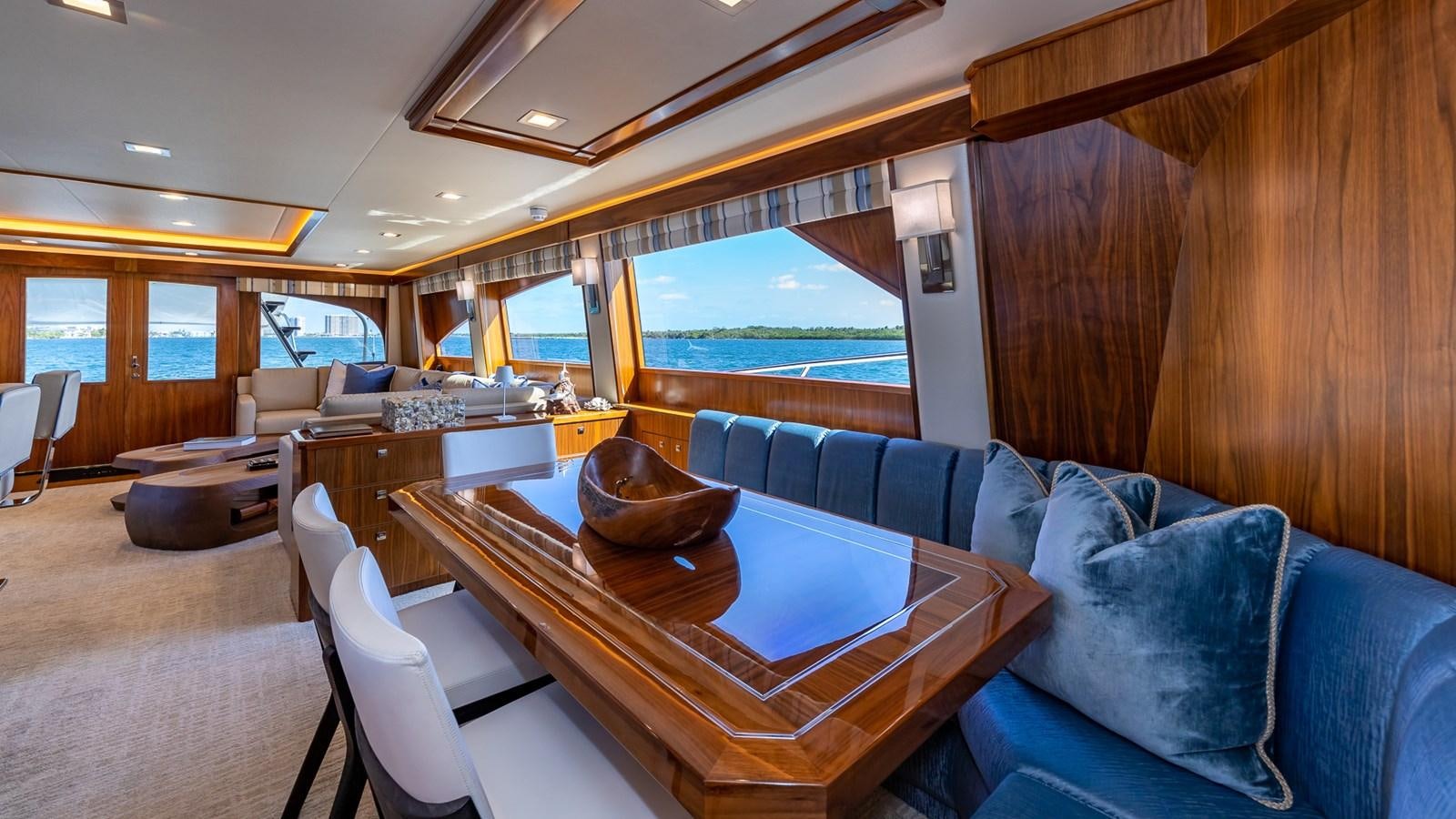 a living room with a large window aboard AUSSIE RULES Yacht for Sale