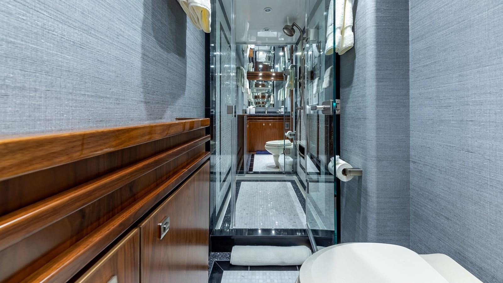 a bathroom with a glass shower aboard AUSSIE RULES Yacht for Sale