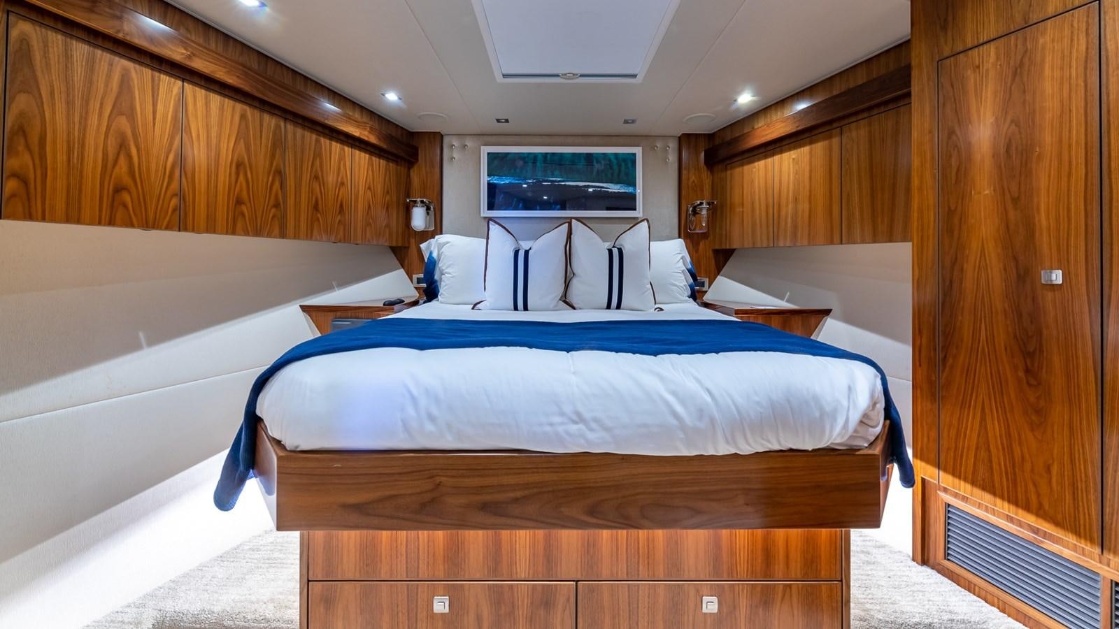 a room with a bed and a television aboard AUSSIE RULES Yacht for Sale