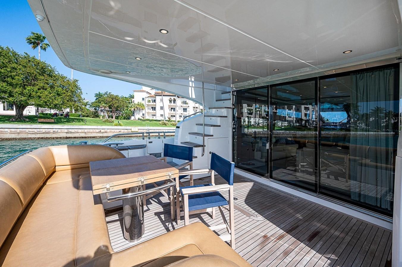 a deck with a table and chairs on it aboard PRINCESS 72 MOTOR YACHT Yacht for Sale