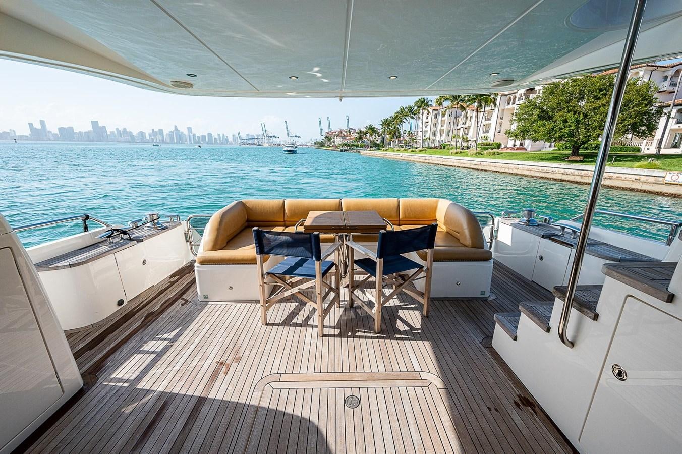a deck with a table and chairs on it aboard PRINCESS 72 MOTOR YACHT Yacht for Sale