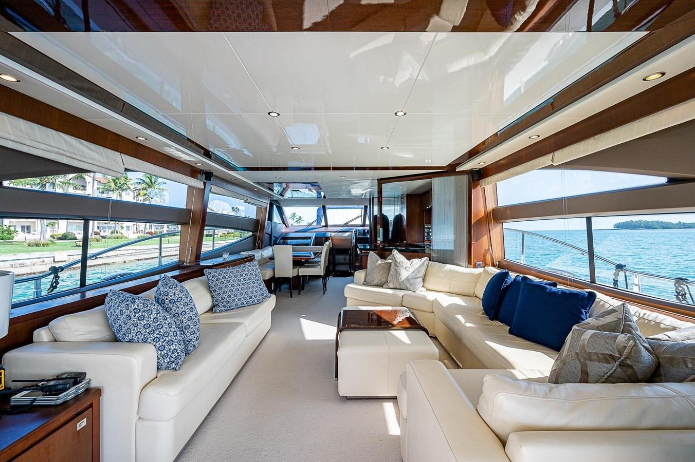a living room with a large window aboard PRINCESS 72 MOTOR YACHT Yacht for Sale