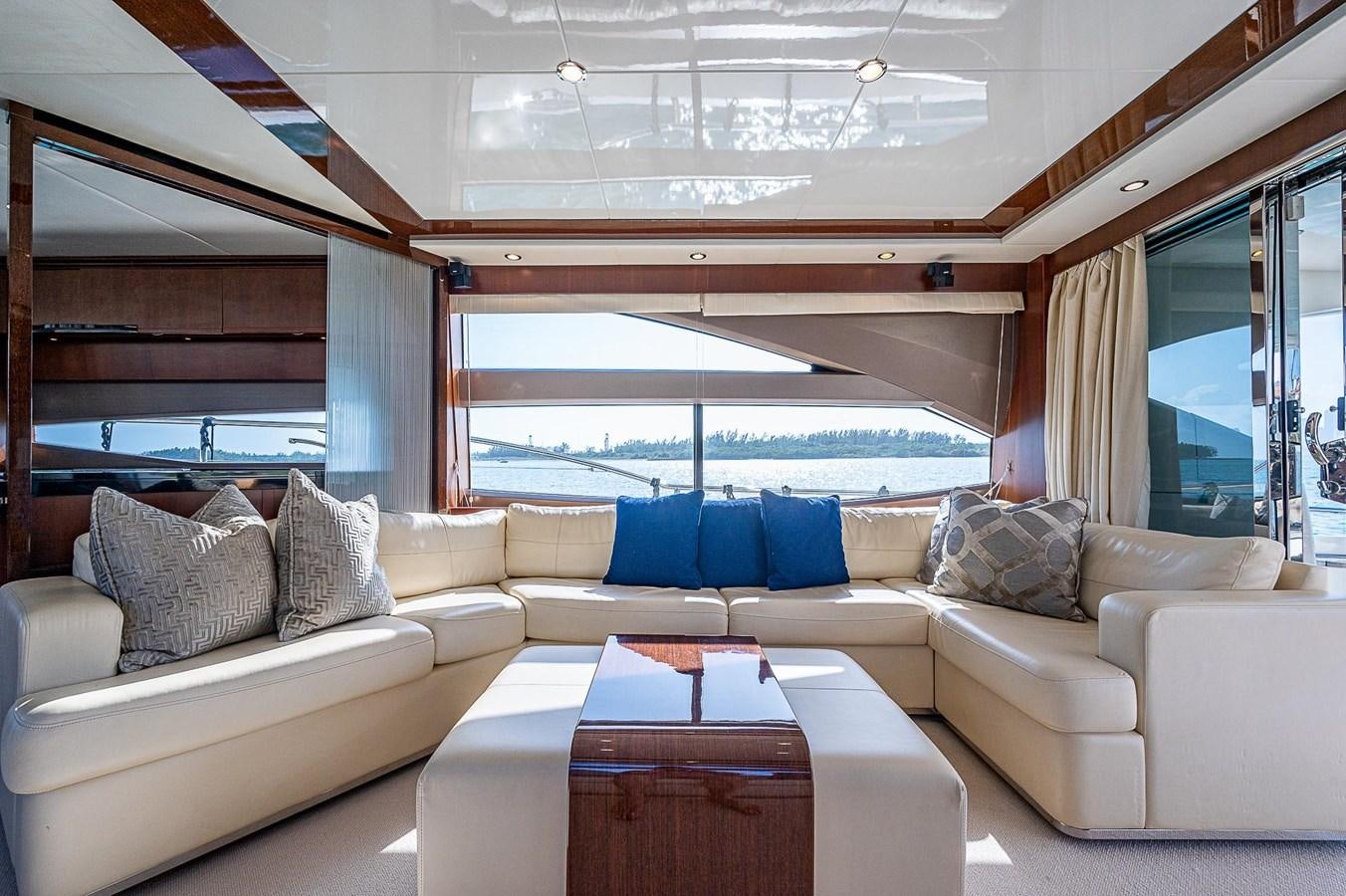 a living room with a large window aboard PRINCESS 72 MOTOR YACHT Yacht for Sale