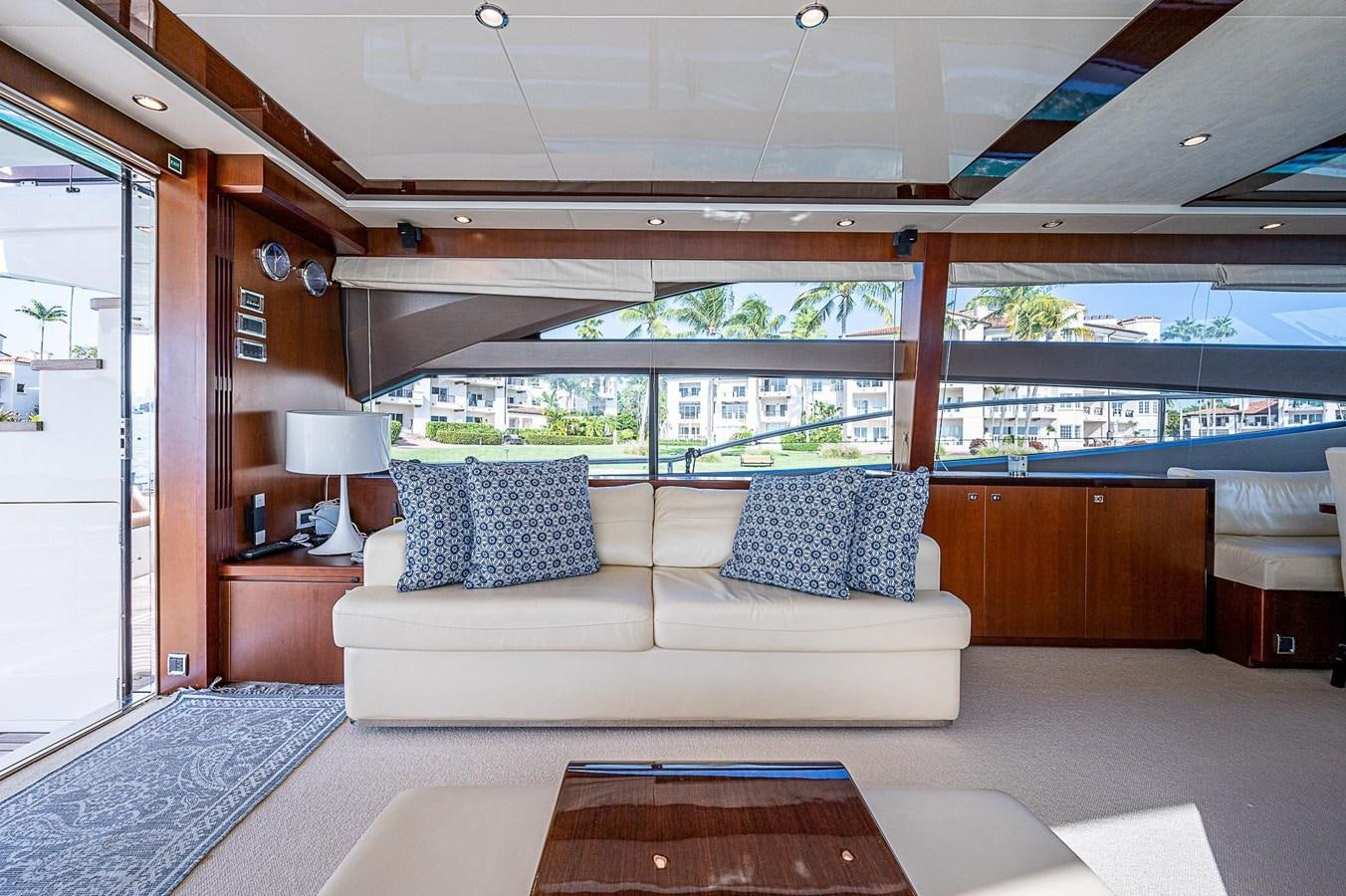 a living room with a large window aboard PRINCESS 72 MOTOR YACHT Yacht for Sale