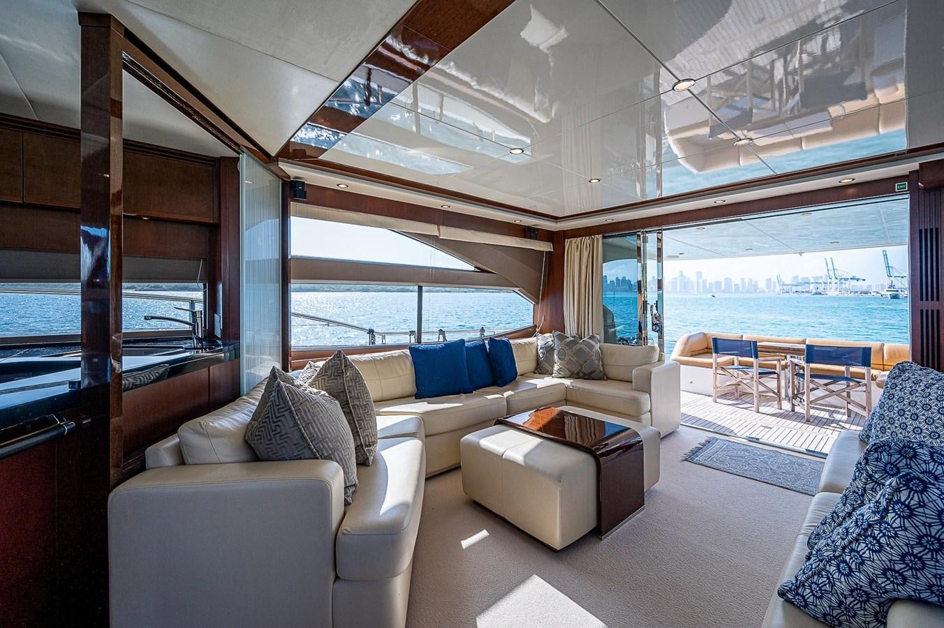 a living room with a large window aboard PRINCESS 72 MOTOR YACHT Yacht for Sale