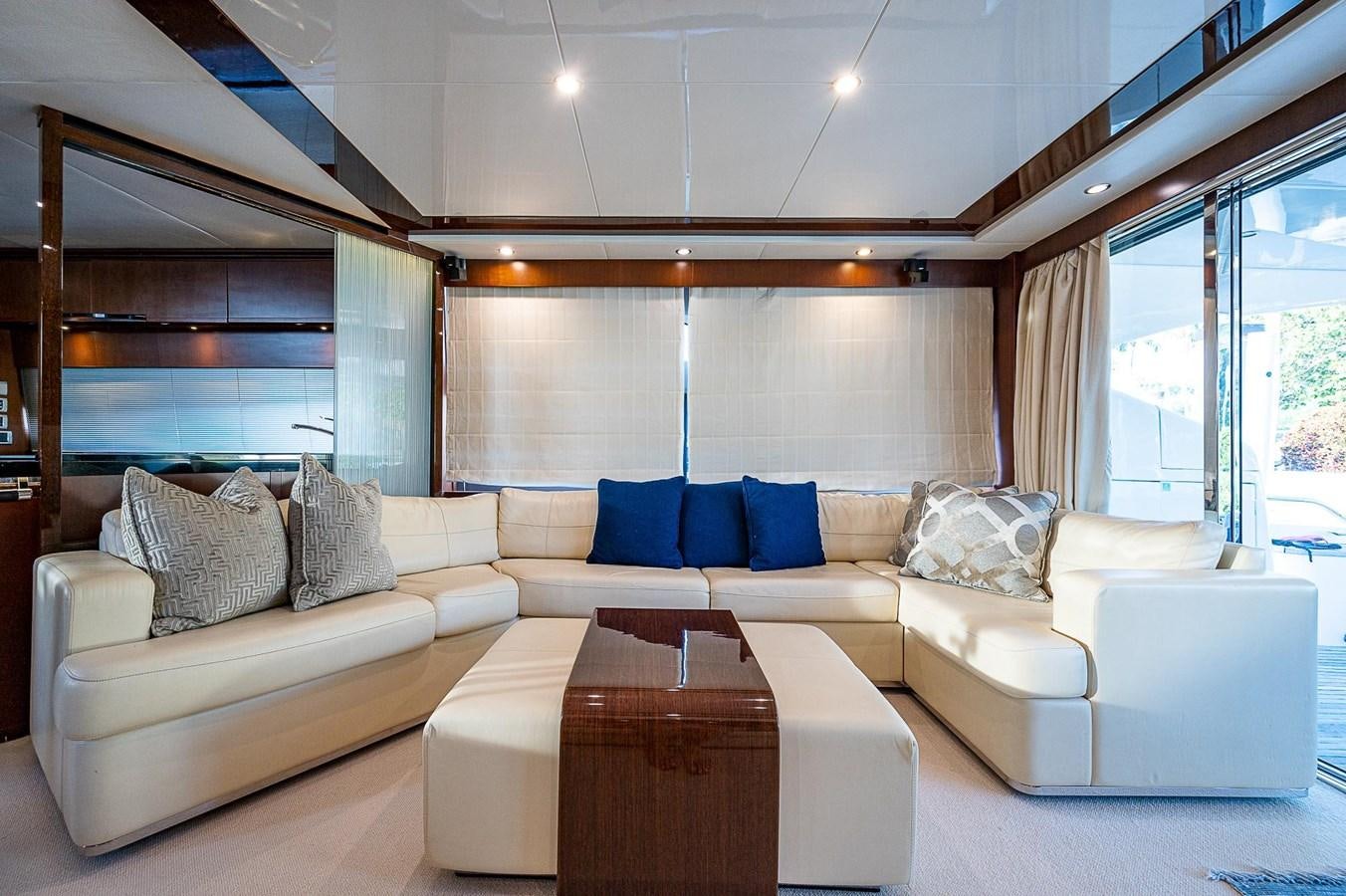 a living room with a couch and a table aboard PRINCESS 72 MOTOR YACHT Yacht for Sale