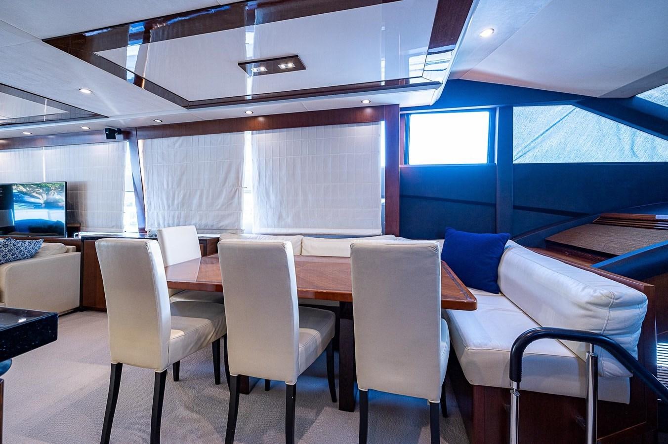 a room with chairs and tables aboard PRINCESS 72 MOTOR YACHT Yacht for Sale