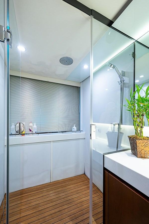 a bathroom with a glass shower aboard PRINCESS 72 MOTOR YACHT Yacht for Sale