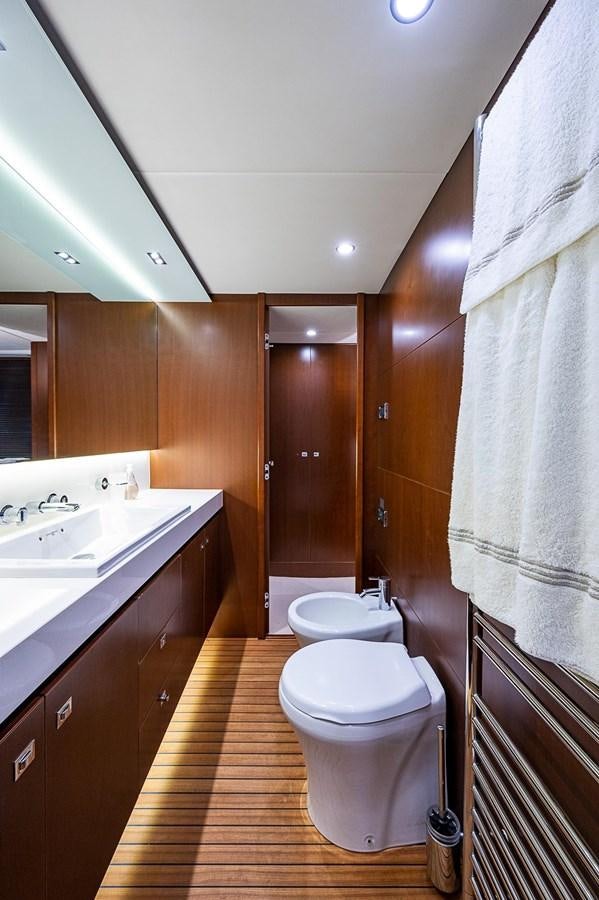 a bathroom with a toilet and sink aboard PRINCESS 72 MOTOR YACHT Yacht for Sale