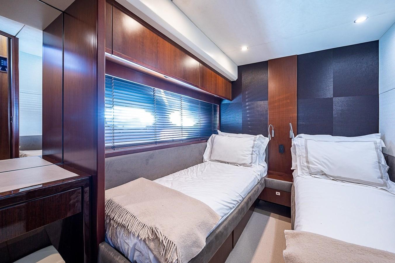 a room with two beds aboard PRINCESS 72 MOTOR YACHT Yacht for Sale