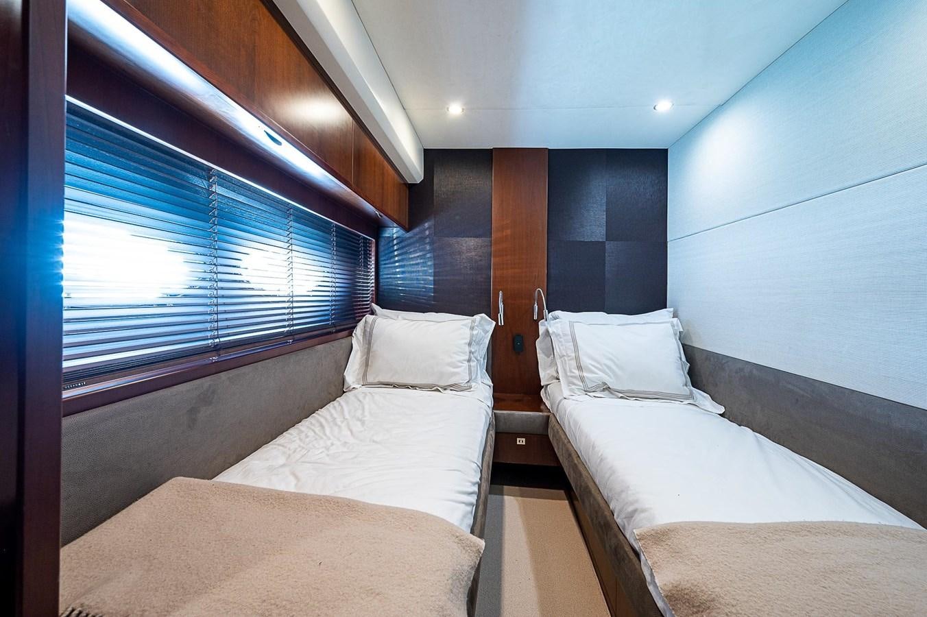 a room with two beds aboard PRINCESS 72 MOTOR YACHT Yacht for Sale