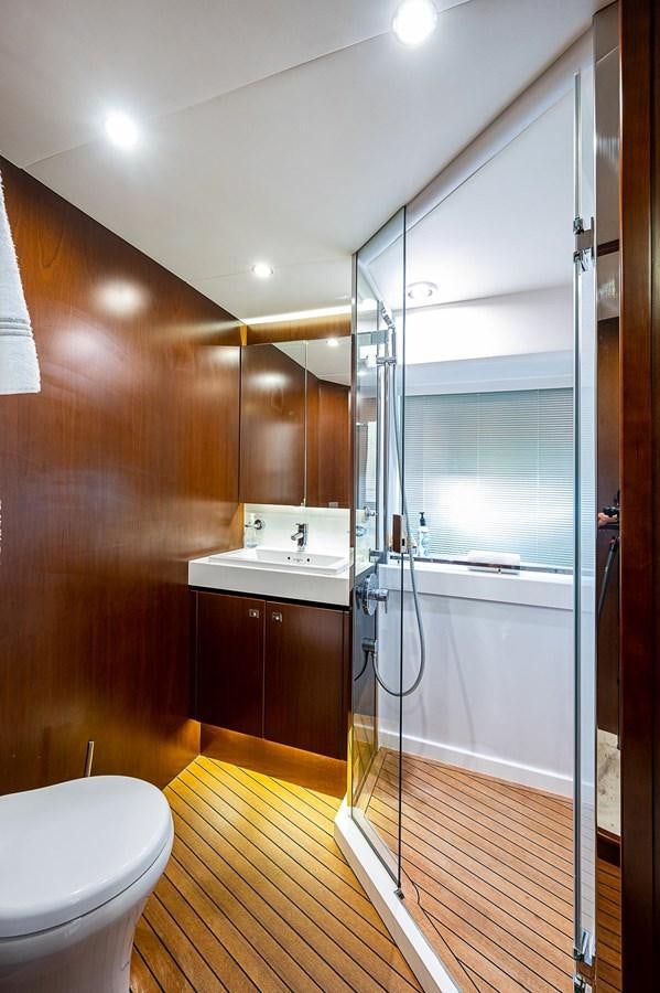 a bathroom with a glass shower aboard PRINCESS 72 MOTOR YACHT Yacht for Sale