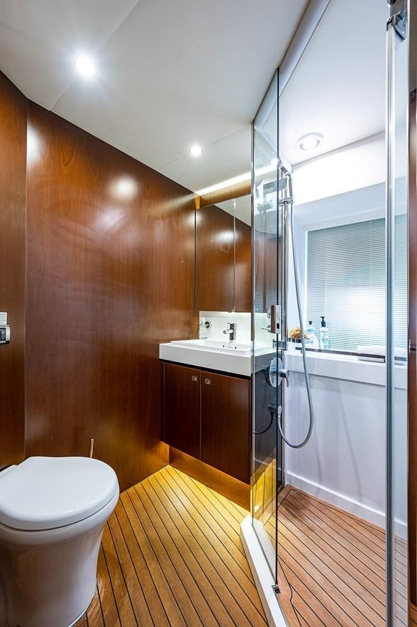 a bathroom with a glass shower aboard PRINCESS 72 MOTOR YACHT Yacht for Sale