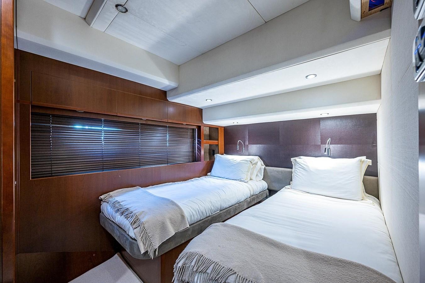 a room with two beds aboard PRINCESS 72 MOTOR YACHT Yacht for Sale
