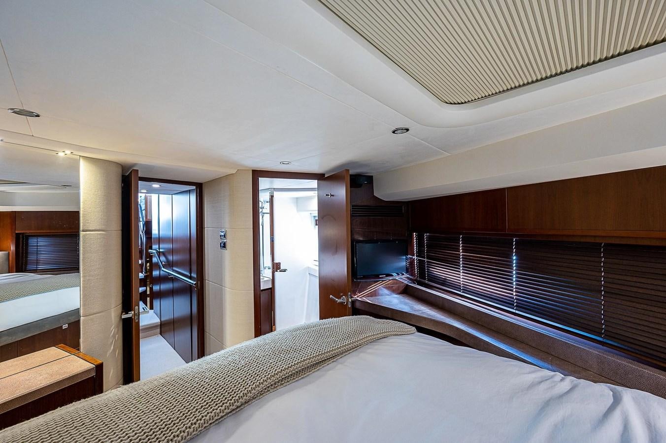 a room with a bed and a door aboard PRINCESS 72 MOTOR YACHT Yacht for Sale