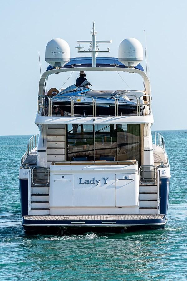 a boat with a large white ship on the water aboard PRINCESS 72 MOTOR YACHT Yacht for Sale