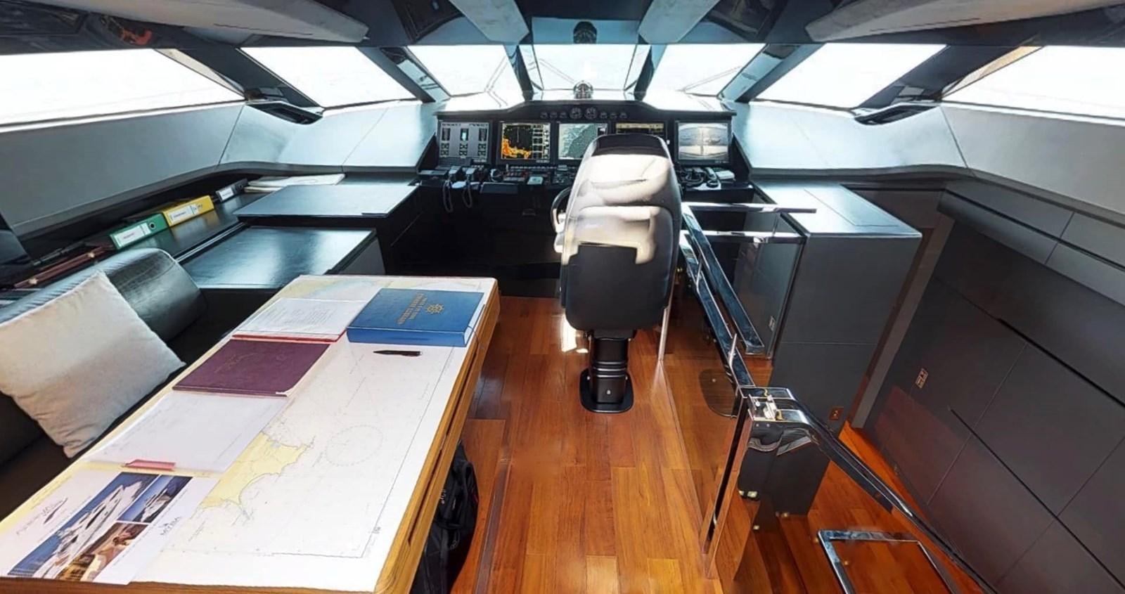 a room with a table and chairs aboard FUSION Yacht for Charter