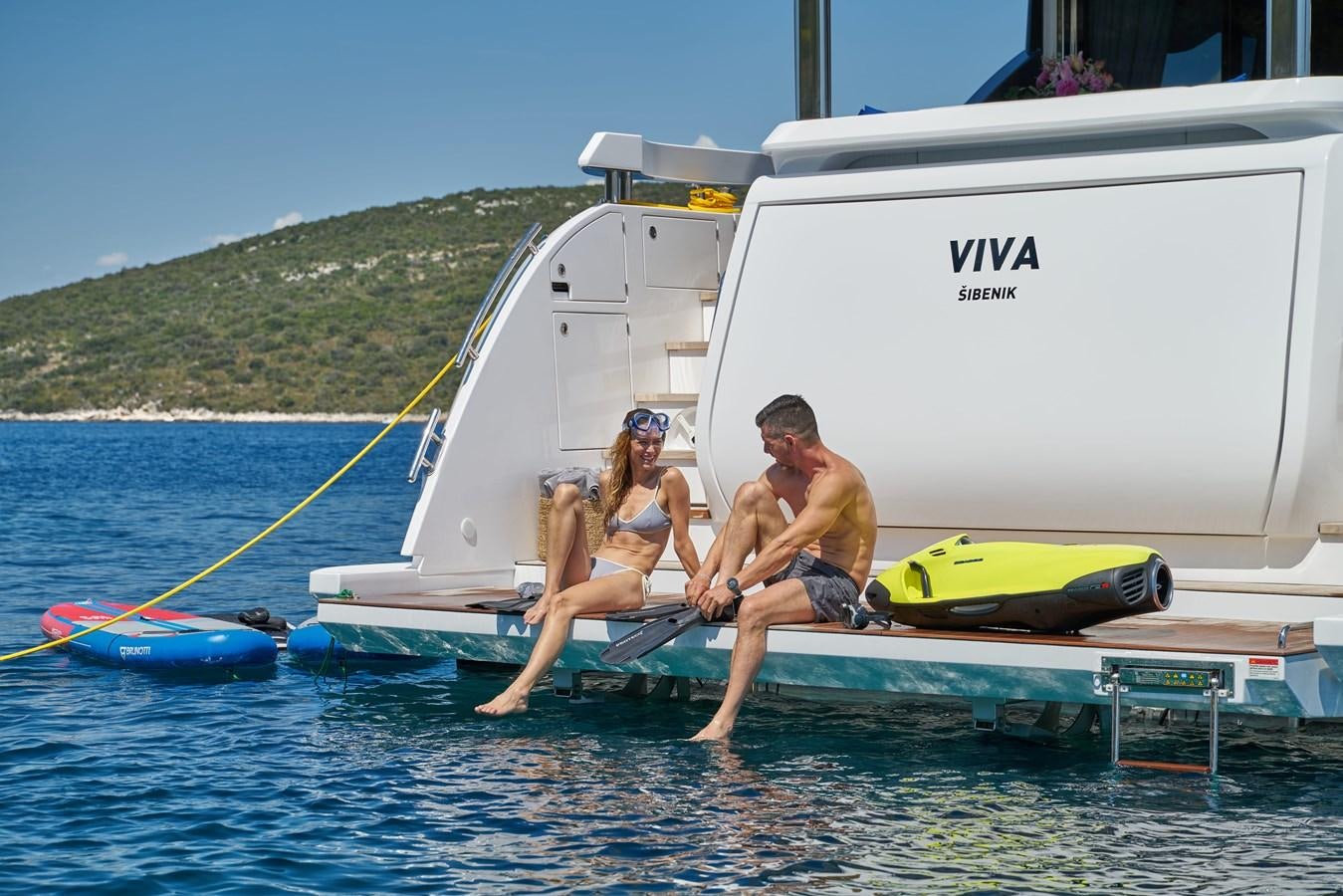 a man and woman on a sailboat aboard VIVA Yacht for Sale