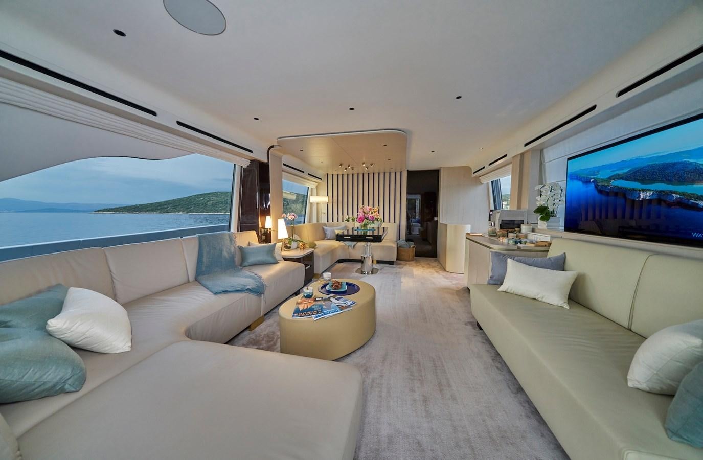 a living room with a large window aboard VIVA Yacht for Sale