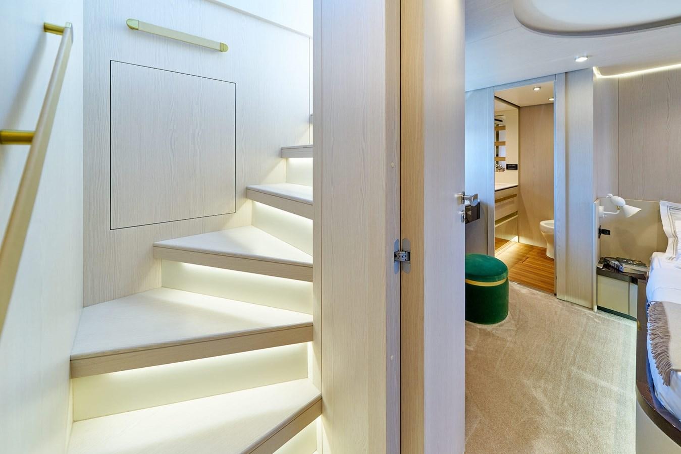 a bathroom with a white door aboard VIVA Yacht for Sale