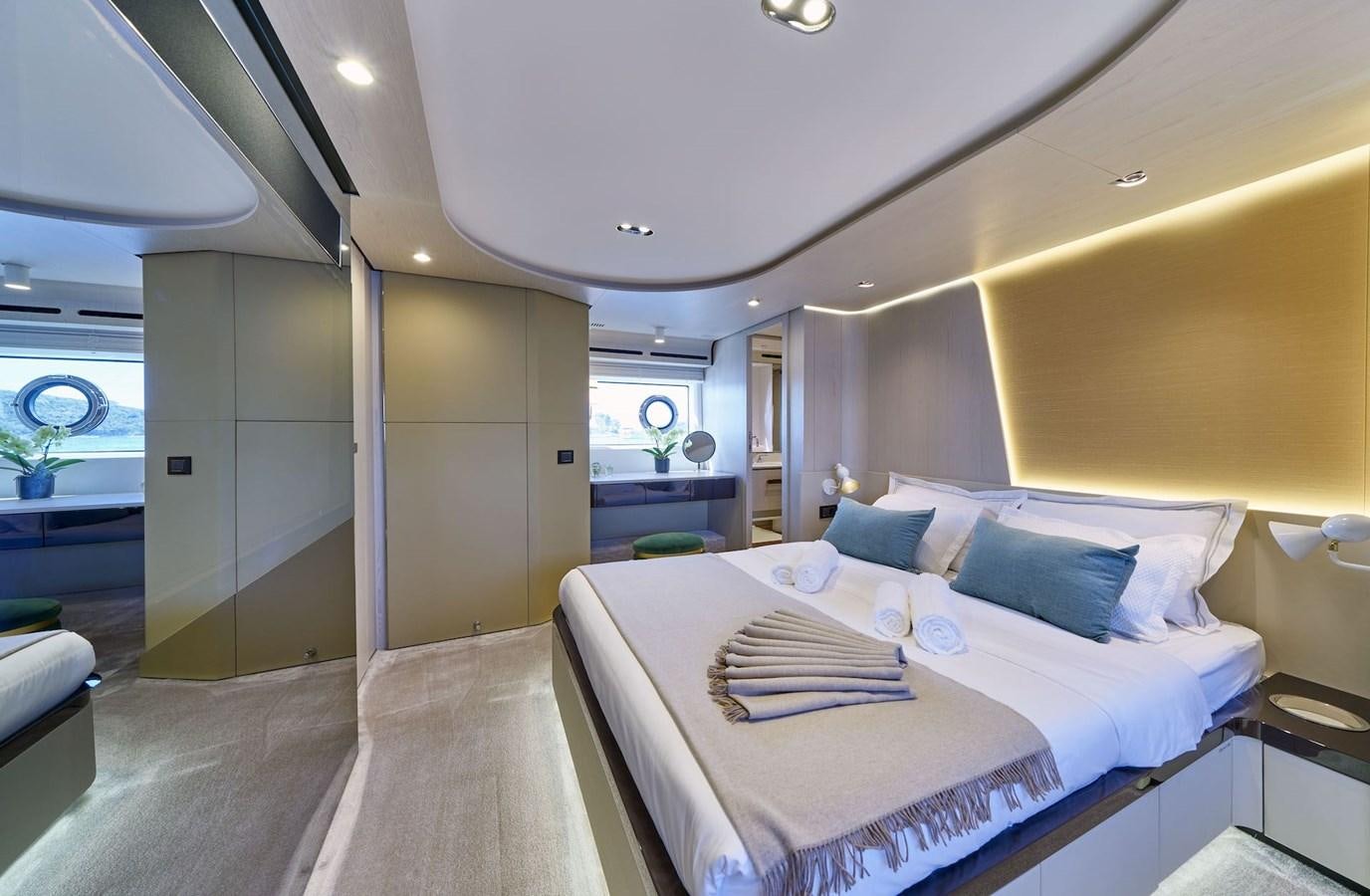 a bed in a room aboard VIVA Yacht for Sale