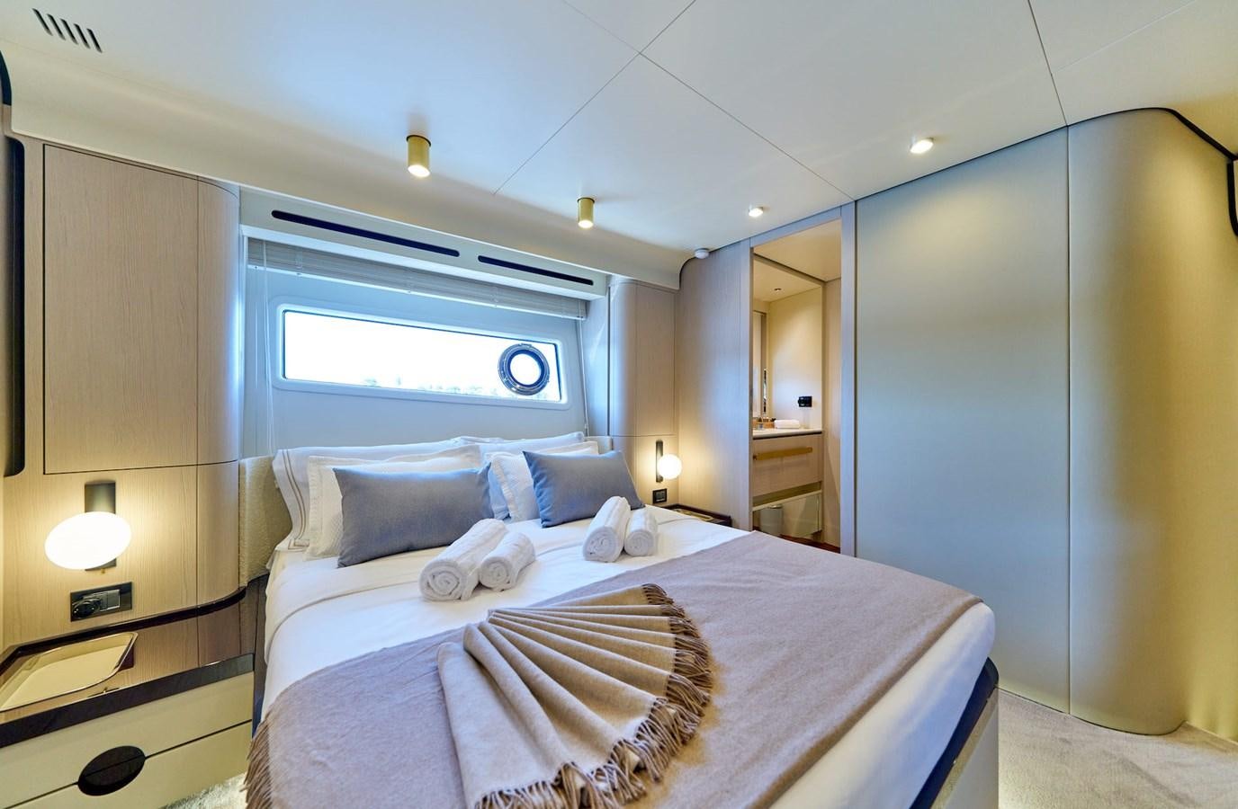 a bed in a room aboard VIVA Yacht for Sale